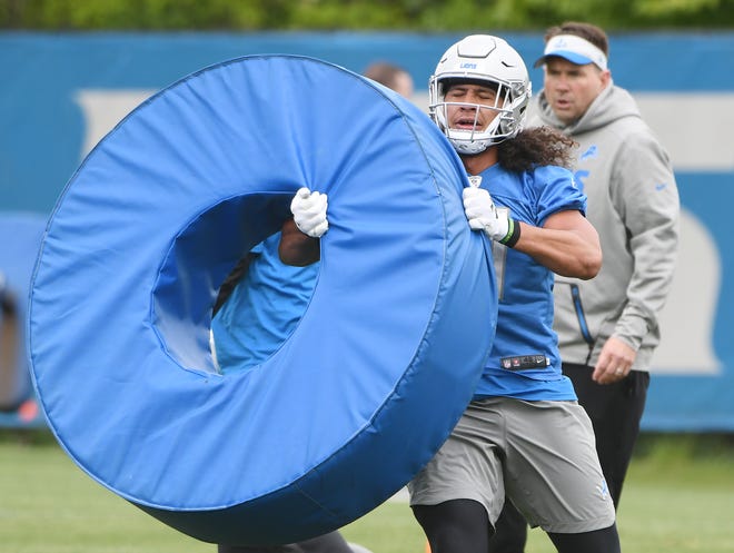 Lions rookie linebacker Jahlani Tavai works through obstacles during drills Tuesday, May 21, 2019, at Allen Park.