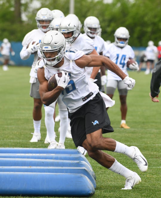 Lions wide receiver Chris Lacy works his through the obstacles during drills.