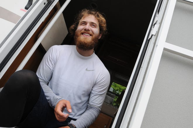 Mike Posner takes a break after a 7.5 mile trek during his walk across America.