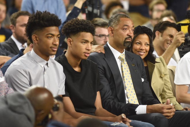 Juwan Howard waits to be introduced as Michigan coach while sitting with his sons (from left) Jace and Jett Howard, and his wife Jenine Howard in Ann Arbor on Thursday, May 30, 2019.