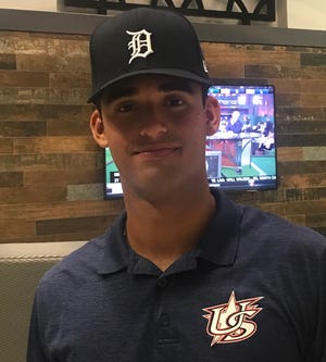 Riley Greene dons a Tigers cap during the MLB Draft on Monday.