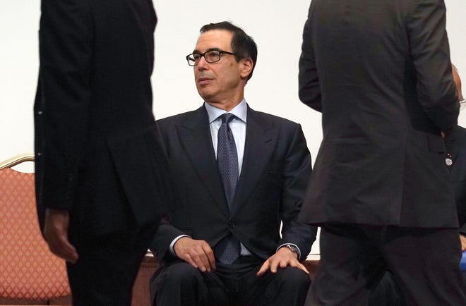 U.S. Treasury Secretary Steven Mnuchin, center, attends a family photo session of the G20 finance ministers and central bank governors meeting Sunday, June 9, 2019, in Fukuoka, western Japan.