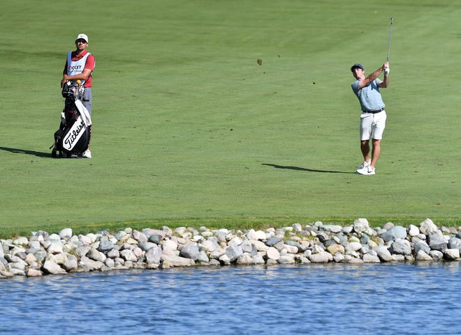 PGA golfer Denny McCarthy hits a fairway shot on hole No. 14.