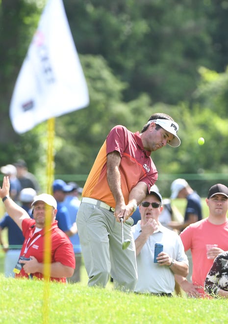 Bubba Watson hits out of the rough on 4.