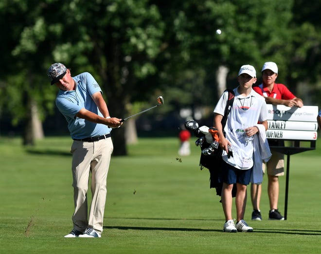 PGA golfer Jason Dufner hits a fairway shot on hole No. 17.