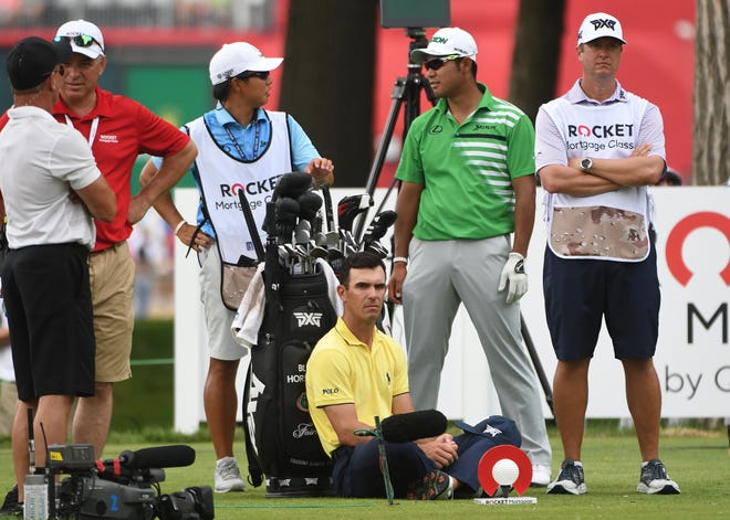 Billy Horschel sits and waits for the group in front of him on the 11th tee.