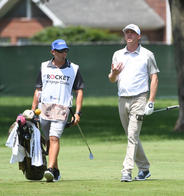 Nate Lashley talks with caddie Ricky Romano on the 12th fairway during the second round of the 2019 Rocket Mortgage Classic. The PGA Tour may have an extra incentive to hold the event this year despite the pandemic.