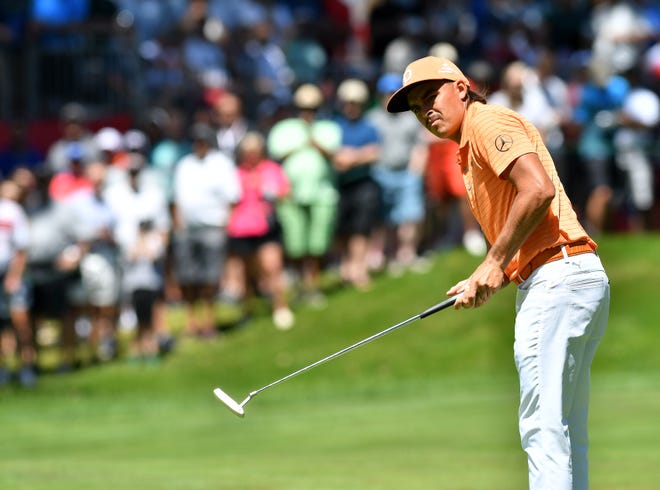 Rickie Fowler hits on the 10th hole.