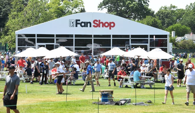 Spectators in the Fan Zone near the PGA Tour Fan Shop.