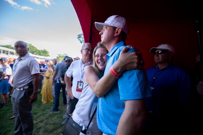 Nate Lashley gets a hug from his sister Brooke Lashley after he won the Rocket Mortgage Classic golf tournament.
