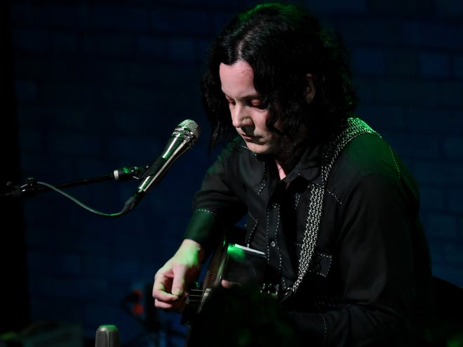 Jack White and Brendan Benson, not shown, perform an acoustic set.