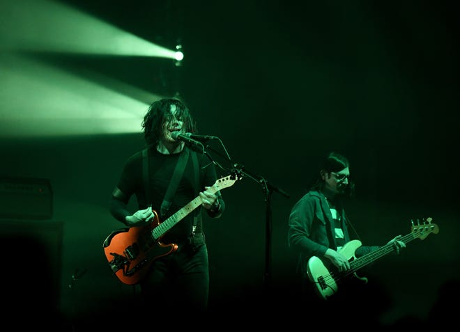 The Raconteurs'  Jack White on guitar and vocals, left, and Jack Lawrence on bass.