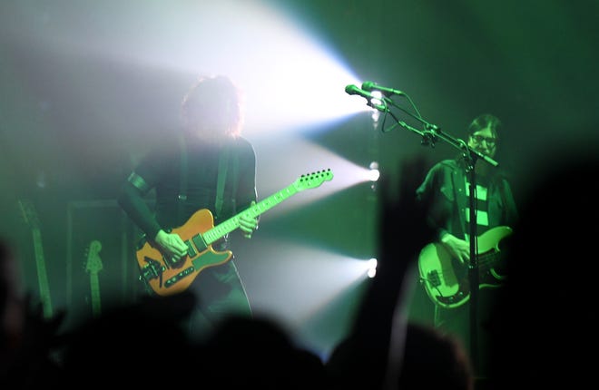 The Raconteurs play "Level" with Jack White on guitar and vocals, left, and Jack Lawrence on bass.