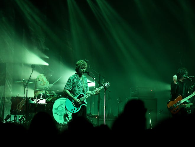 The Raconteurs', from left, Patrick Keeler on drums, Brendan Benson on guitar and vocals along with Jack White.