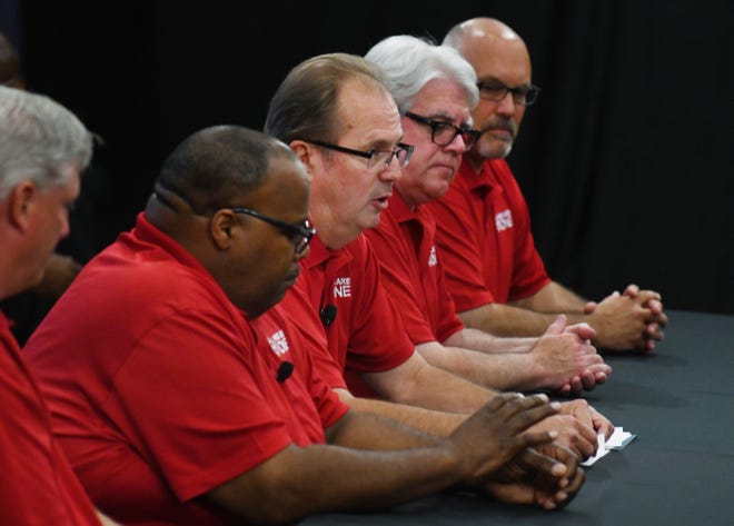UAW President Gary Jones, center, and the UAW negotiating team open contract negotiations with Ford Motor Co. Monday in Dearborn.
