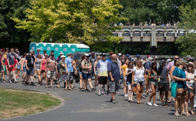 The line to enter the Michigan Brewers Guild Summer Beer Festival on Saturday extends out of Ypsilanti's Riverside Park and up onto the Cross Street bridge over the Huron River.