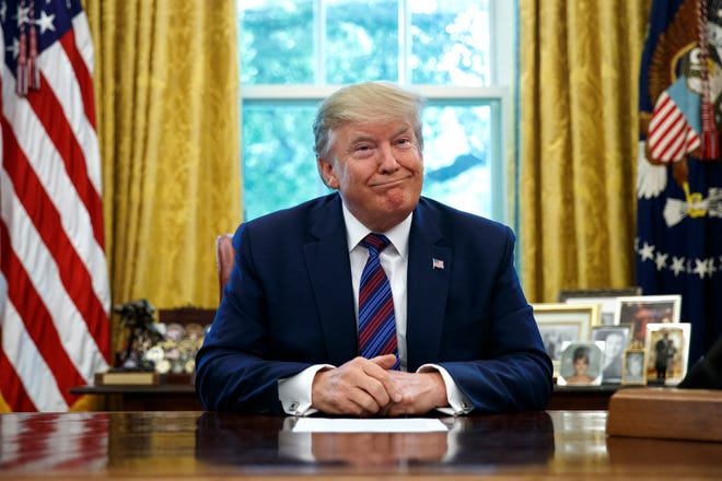 President Donald Trump pauses as he speaks in the Oval Office of the White House in Washington, Friday, July 26, 2019. Trump announced that Guatemala is signing an agreement to restrict asylum applications to the U.S. from Central America. (AP Photo/Carolyn Kaster)