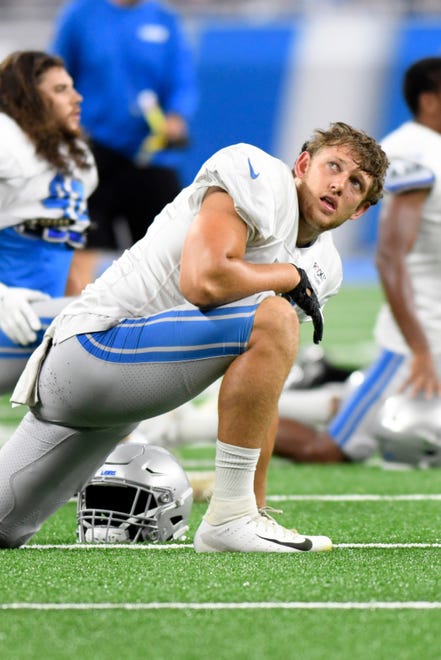 Lions rookie tight end T.J. Hockenson stretches during the open practice session at Lions Family Fest.
