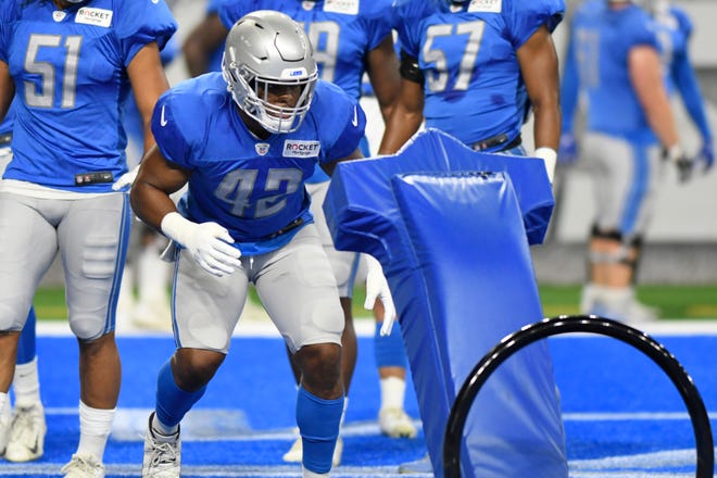 Detroit Lions linebacker Devon Kennard prepares to hit a tackling dummy during the open practice session at Lions Family Fest on Friday, Aug. 2, at Ford Field in Detroit.