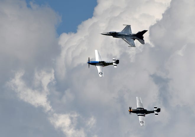 Two P-51's and a F-16 fly in formation during a 'Heritage Flight.'