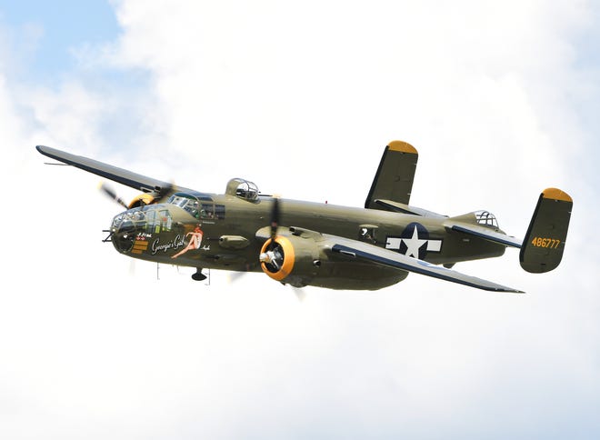 The B-25 'Georgie's Gal' roars over the crowd at the Thunder Over Michigan Air Show.