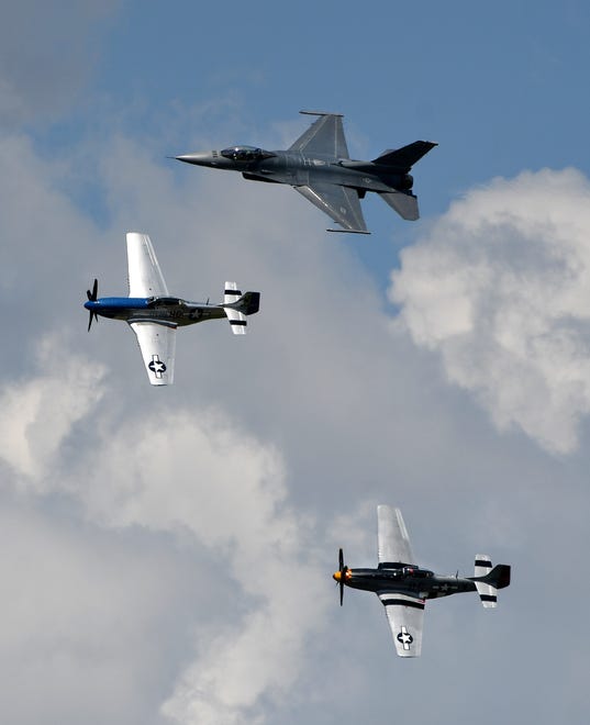 Two P-51's and a F-16 fly in formation during a 'Heritage Flight.'