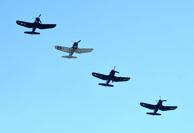 Four of ten Vought F4U Corsairs take to the sky over Willow Run Airport.