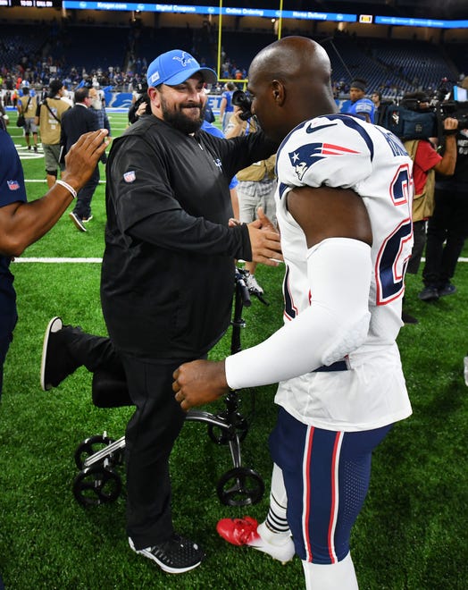 Lions head coach Matt Patricia greets one of his former players from when he was a coach with New England, Duron Harmon after the Lions loss.