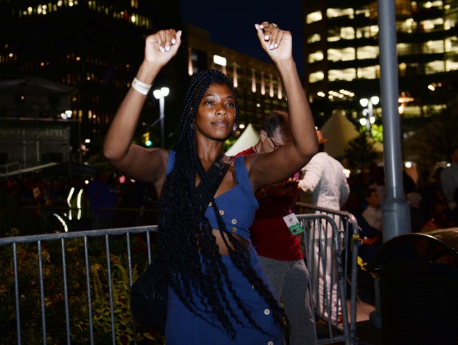 Lauren Stovall, 37, of Detroit, dances to the music at the JP Morgan Chase Main Stage.