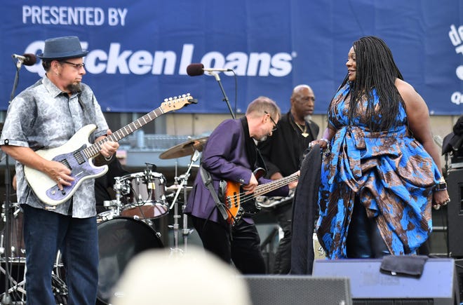 Thornetta Davis performs with the Chisel Bros., Brian White, left, on guitar and Tim Duvalier on bass, on the Carhartt Ampitheater Stage at Hart Plaza at the Detroit International Jazz Festival in Detroit on Sept. 1, 2019.
