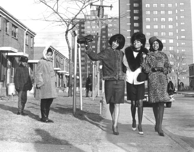 The Supremes met in the late 1950s in Detroit's Brewster-Douglass housing project. Originally known as the Primettes, by the time they signed to Motown in 1961, they had been renamed the Supremes. Here, the Supremes, Florence Ballard, Diana Ross and Mary Wilson, walk near Detroit's Brewster Projects in 1965.