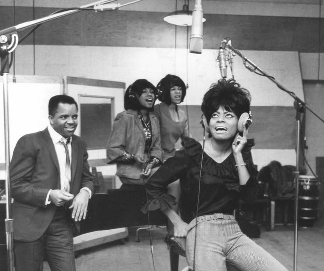Berry Gordy listens as The Supremes lay down a track during a January 1965 recording session at Motown Records' Studio A, 2648 W. Grand Blvd. From left are Berry Gordy Jr., Mary Wilson, Florence Ballard and Diana Ross. A copy of this photo is mounted on the wall of Studio A today, for visitors to the Motown Museum to see.
