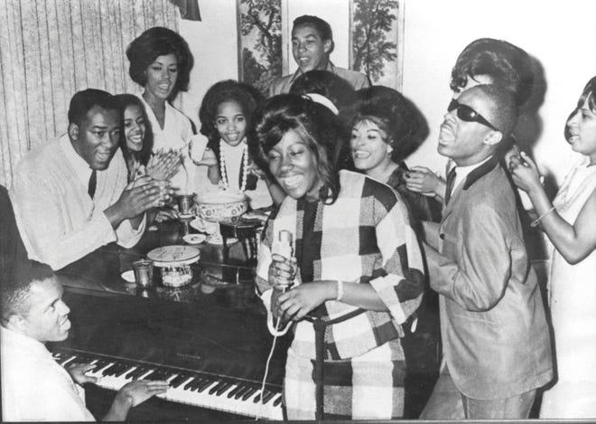 Vintage Motown from the 1960s: Kim Weston takes the lead while Berry Gordy accompanies her on the piano and Marv Johnson, next to Gordy, claps while Little Stevie Wonder, Smokey Robinson and others provide backup.