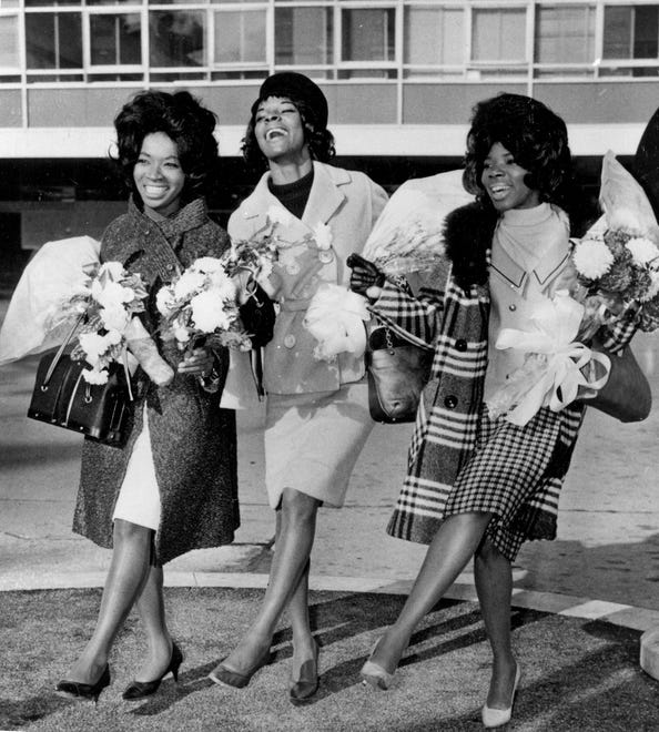 Martha Reeves and the Vandellas dance for photographers in London, after arriving  on Nov. 3, 1964  for TV appearances and recording work in the British capital. From left are Betty Kelly, Martha Reeves, and Rosalind Ashford.