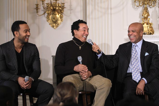 From left, singers John Legend, Smokey Robinson and Motown founder Berry Gordy Jr.  hold a discussion hosted by first lady Michelle Obama for students, highlighting Motown artists, Feb. 24, 2011, in the State Dining Room of the White House in Washington.