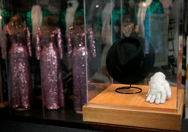 In this Jan. 20, 2006 photo, the original hat and sequined glove worn by Michael Jackson while he performed "Billy Jean" on the Motown's 25th Anniversary NBC-TV special is shown along with costumes worn by the Supremes, the Temptations, and Brenda Holloway, at the Motown Museum in Detroit.