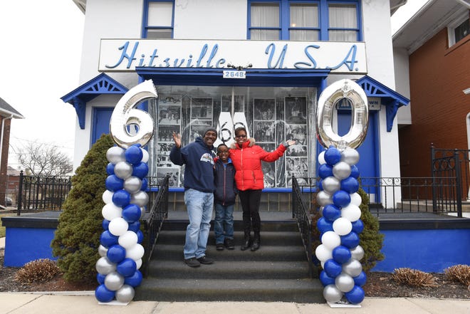 Visitors Steve Thomas, left, of Oak Park,  his son DeMarco, 10, and wife Lisette smile and wave outside the Motown Museum as it promotes its 60th anniversary on January 12, 2019.  The museum has planned a series of events Sept. 21-24 to celebrate the 60th anniversary of Motown Records.
