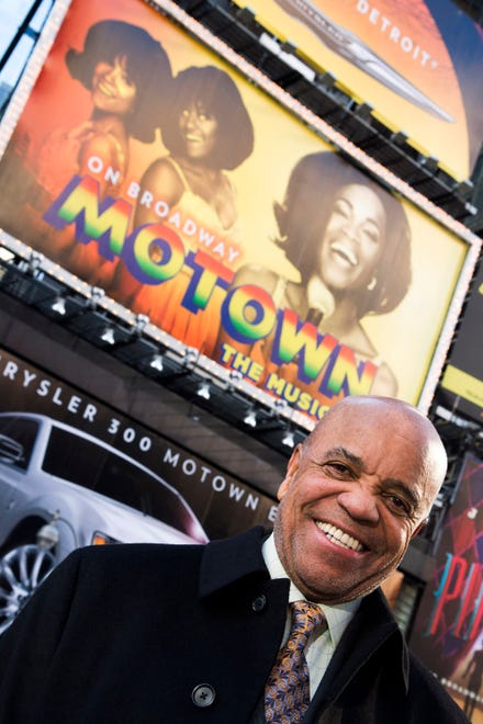 Berry Gordy, 83, poses in front of a billboard for "Motown: The Musical" in Times Square in New York on March 5, 2013.  For Gordy, conquering Broadway was another major milestone in a magical  musical career.