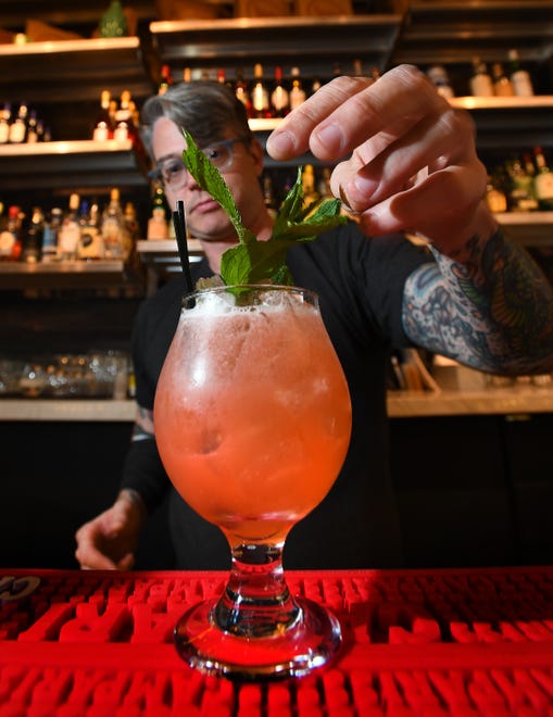 Grandma Bob's Hamdmade Pizza bar manager Scott Poole makes a Snap Dragon consisting of Cabresto Silver Tequila, strawberry syrup, lime and Rose' Lambrusco.