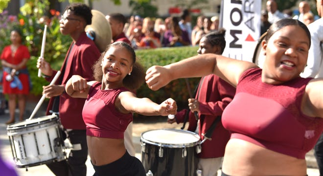 Members of the Mumford High School Marching Band perform at the beginning of the event.