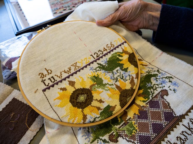 Delores Carter of Farmington Hills works on an Embroidery Guild project.