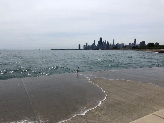 Lake Michigan floods a walkway near the docks in the Lincoln Park neighborhood of Chicago on Aug. 30,
2019. In early October, steady rain and  rising tides resulted in portions of scenic Lake Shore Drive in Chicago being closed for two hours because of flooding.