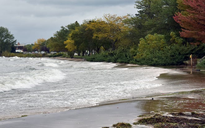 The beach at Clinch Park in Traverse City is under water on Oct. 16, 2019. Gale-force winds on Lake Michigan and Grand Traverse Bay pushed near-record-high water onto shore, causing erosion.