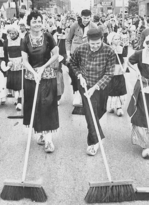 The Millikens continue the tradition of Michigan governors dressing in traditional Dutch clothing and sweeping the street at the Tulip Time Festival in Holland, Michigan in 1978.