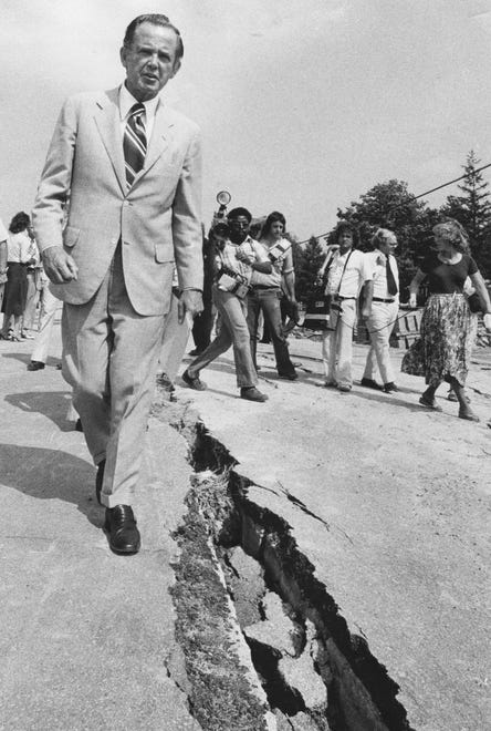Gov. Milliken inspects a sewer break in Macomb County on Aug. 8, 1978.