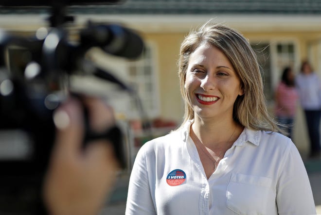 FILE - In this Nov. 6, 2018 file photo, Katie Hill, then a Democratic Party candidate from California's 25th Congressional district, talks to a reporter after voting in her hometown of Agua Dulce, Calif.