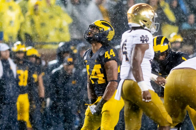 Michigan linebacker Cameron McGrone celebrates after helping to tackle Notre Dame's quarterback in the second quarter.