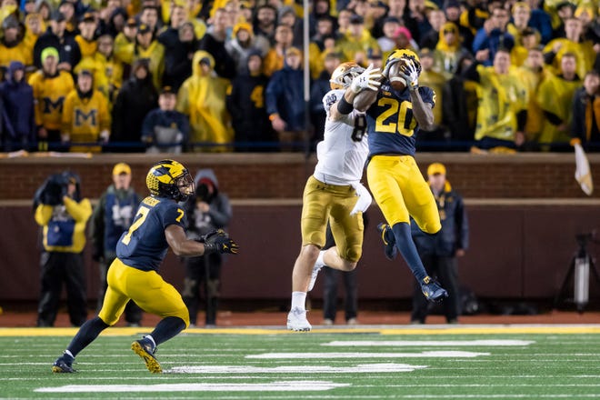 This interception by Michigan defensive back Brad Hawkins  on a pass intended for Notre Dame tight end Cole Kmet was called back due to an interference call on linebacker Khaleke Hudson, left.