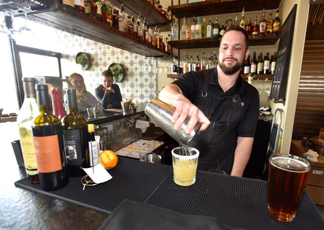 General manager / bartender Gedde Naschak, of Chesterfield Twp., makes La Cinorita, a cinnamon-infused tequila margarita.