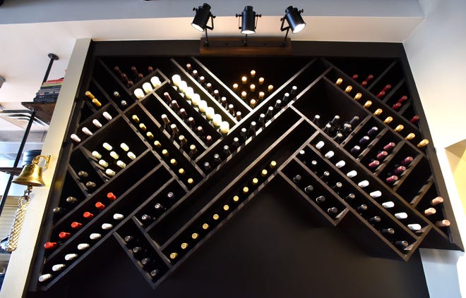 A wine rack inside Regal Craft Food & Drink in Macomb Township. Wine is served by the bottle or 6- or 9-ounce pours.